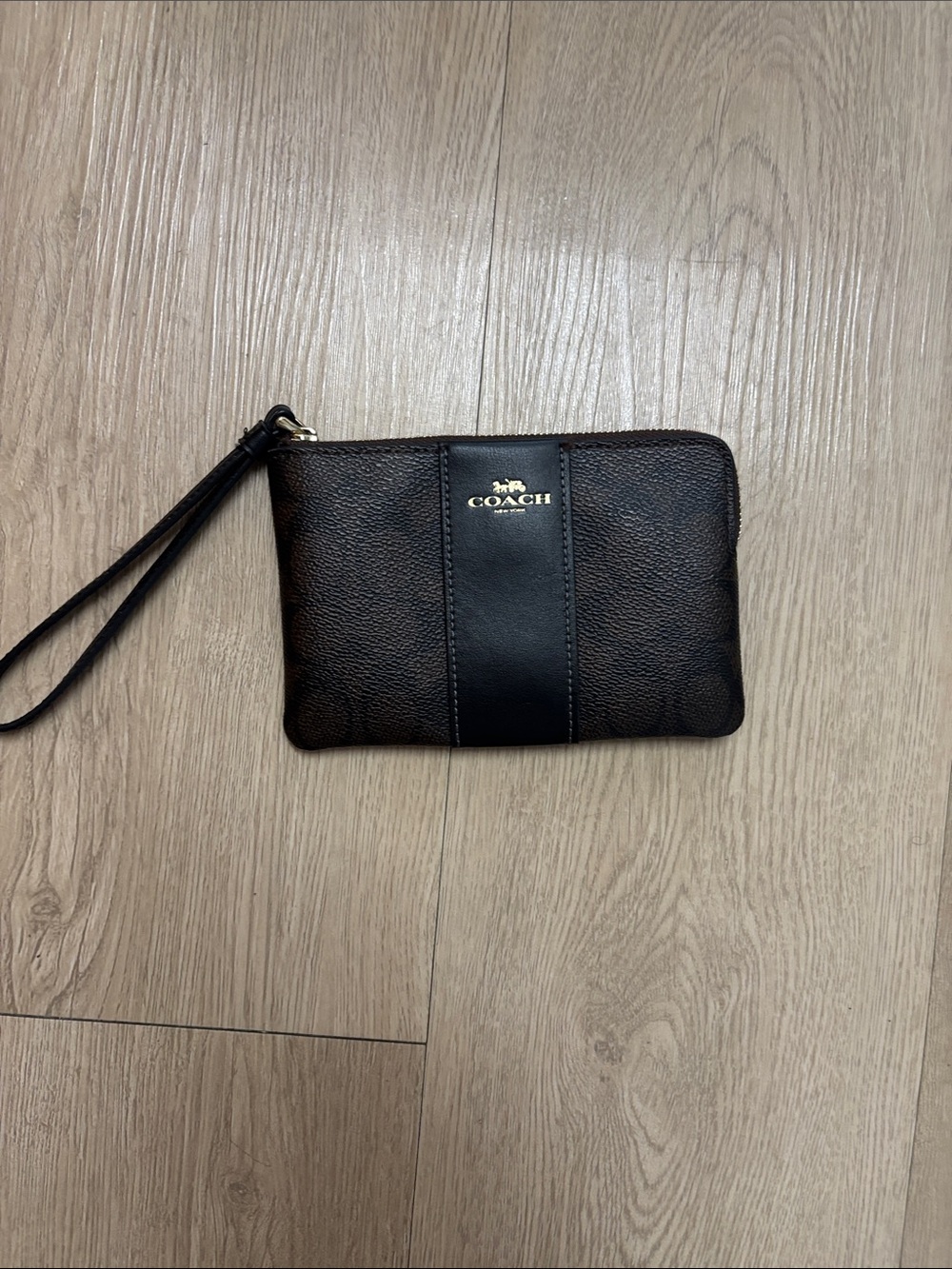 COACH Brown Pebbled Leather Wristlet with Black Center Stripe